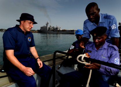US Navy 100315-N-7948C-045 Nigerian sailor Maji Isah Ocheje demonstrates proper knot-tying techniques during a basic small boat operation workshop photo