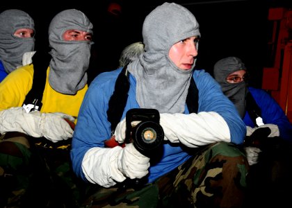 US Navy 100315-N-8655E-037 Sailors assigned to the air department aboard the multipurpose amphibious assault ship USS Bataan (LHD 5) participate in a hangar bay fire drill