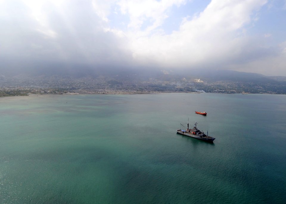 US Navy 100316-N-5961C-001 USNS Grasp (T-ARS 51) is at anchor in the Port-au-Prince harbor as divers work on the city's pier