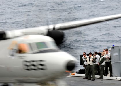 US Navy 100312-N-7908T-118 Landing signals officers aboard aircraft carrier USS George H.W. Bush (CVN 77) watch an E2-C Hawkeye