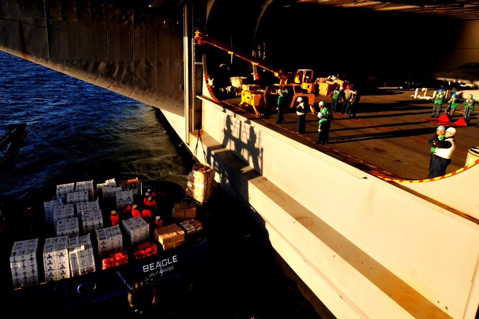 US Navy 100314-N-2953W-587 Sailors aboard the aircraft carrier USS Carl Vinson (CVN 70) load supplies off the coast of Punta Arenas, Chile