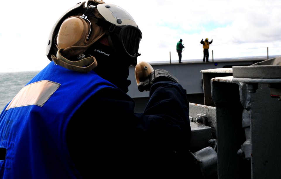 US Navy 100314-N-8822R-096 Aviation boatswain's mates from the air department of the aircraft carrier USS Carl Vinson (CVN 70) operate an aircraft elevator