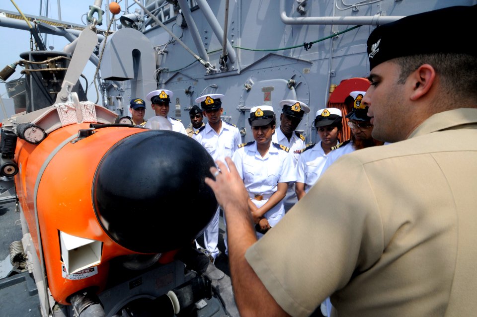 US Navy 100314-N-8335D-208 Mineman 2nd Class Zachary Sund shows a mine-neutralization vehicle to sailors from the Bangladesh navy