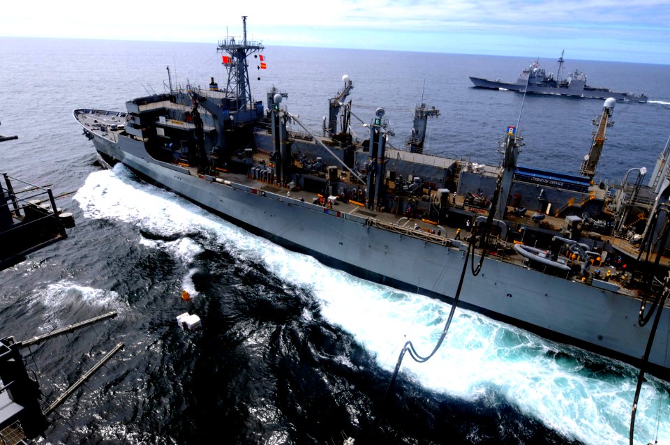 US Navy 100318-N-4275C-464 USS Carl Vinson (CVN 70) receives fuel from USNS Rainier (T-AOE 7) while the guided-missile cruiser USS Bunker Hill (CG 52)
