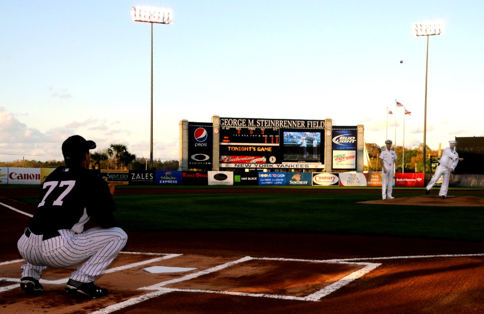 US Navy 100318-N-5366K-209 Navy Counselor 2nd Class Paul Lacey, assigned to Navy Recruiting District Miami, throws out the first pitch at a New York Yankees spring training game at Steinbrenner Field in Tampa, Fla