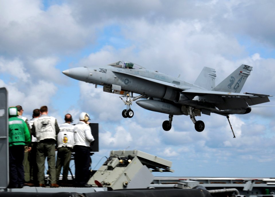 US Navy 100314-N-9116S-289 An F-A-18C Hornet assigned to Strike Fighter Squadron (VFA) 106 lands aboard the aircraft carrier USS George H.W. Bush (CVN 77)