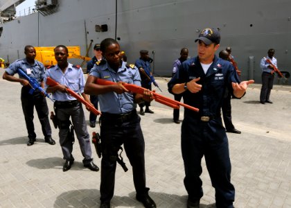 US Navy 100315-N-6676S-099 Electronics Technician 2nd Class Corey Brown works with Ghana navy Lt. j.g. Frank Boateng during an Africa Partnership Station West civil disturbance training class