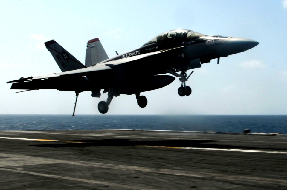 US Navy 100313-N-3038W-450 An F-A-18E Super Hornet lands on the aircraft carrier USS Nimitz (CVN 68)