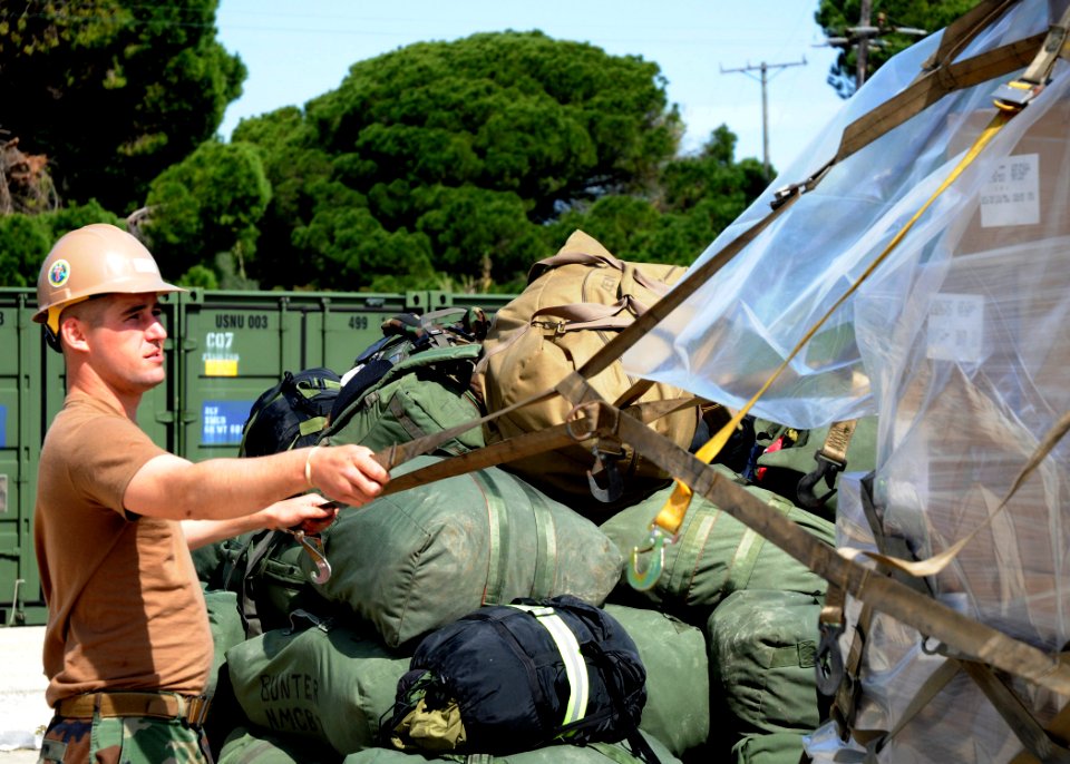 US Navy 100318-N-6357K-006 A Seabee assigned to Naval Mobile Construction Battalion (NMCB) 7 prepares materials for shipment to support a detachment of NMCB-7 Seabees deploying to Latvia