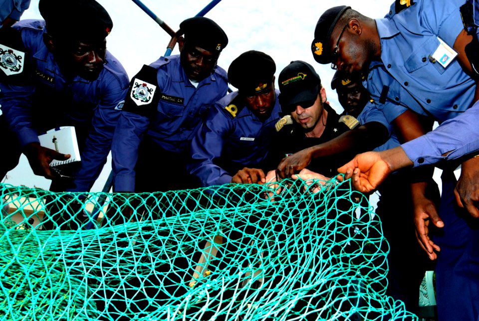 US Navy 100315-N-7948C-177 talian navy Lt. Federico Panconi shows an example of a properly constructed fishing net to Nigerian and Ghanaian sailors