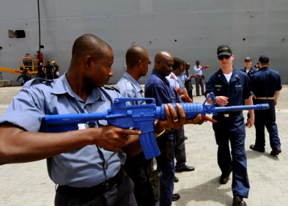 US Navy 100315-N-6676S-095 Logistics Specialist 3rd Class Jerdone McGhee works with service members from the Nigerian, Ghanaian, Benin, and Togo navy photo