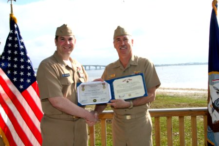 US Navy 100318-N-6936D-042 Rear Adm. Tim Alexander, commander of Navy Region Southeast, presents the Bronze Star medal to Lt. Stephen Wangelin
