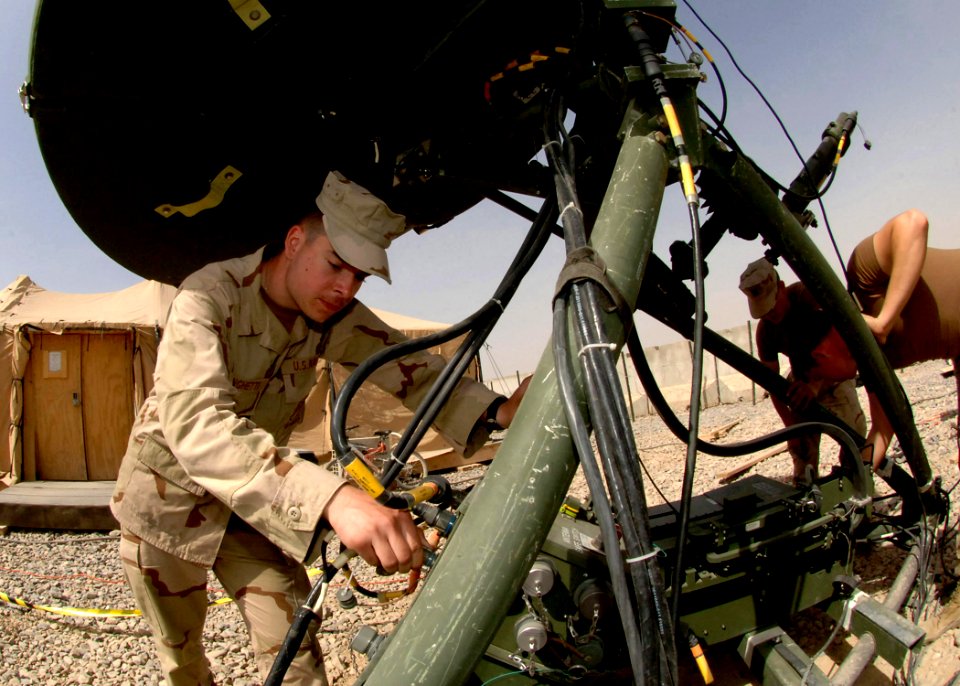 US Navy 100315-N-8816D-087 Information Systems Technician Seaman David Springhetti sets up a rugged deployable satellite for communications