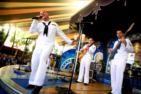 US Navy 100317-N-3271W-015 Musician 3rd Class Sean Meyer, lead singer of the U.S. Navy Band Southeast contemporary ensemble, Pride, performs for patrons at Busch Gardens photo