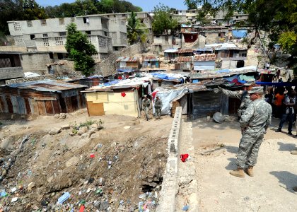 US Navy 100316-N-5961C-007 Lt. Col. David Doyle briefs Lt. Gen. Ken Keen on the internally displaced persons camps that are in his area of responsibility