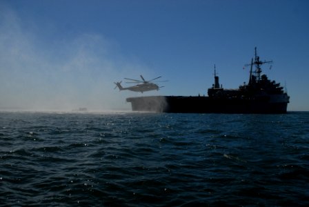 US Navy 100317-N-9706M-155 A CH-53 Sea Stallion helicopter lands on the flight deck of the amphibious transport dock ship USS Dubuque (LPD 8) photo