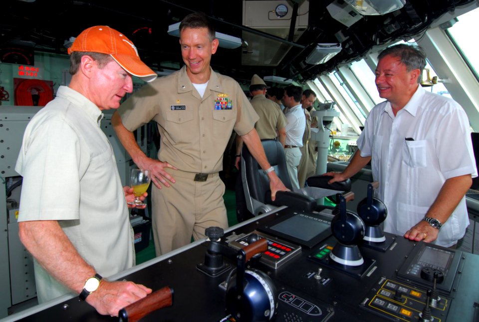 US Navy 100320-N-7058E-109 U.S. Ambassador to Colombia William Brownfield, left, examines the main control console on the bridge of the littoral combat ship USS Freedom (LCS 1)