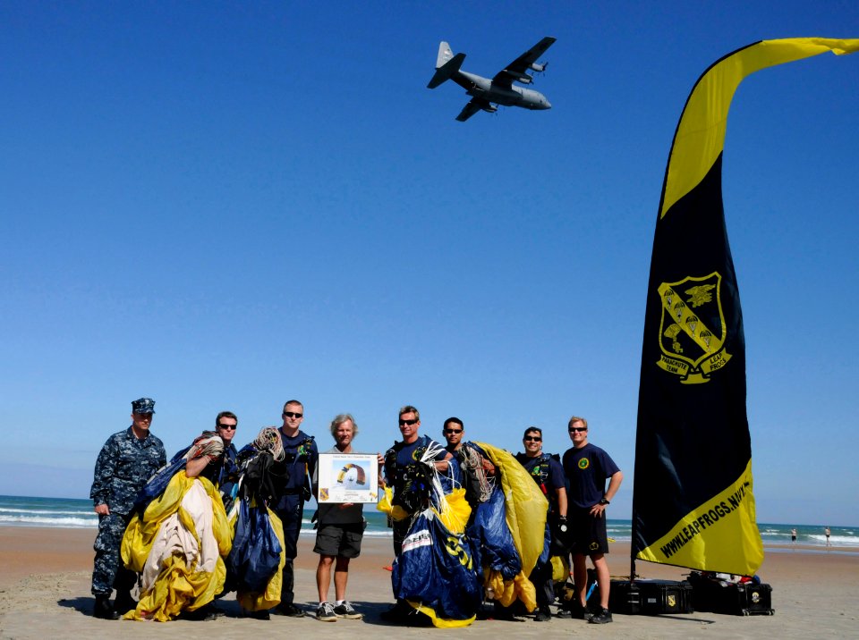 US Navy 100320-N-5366K-103 The Leap Frogs present a signed lithograph to Rob Wallace of the Naval Special Warfare Foundation after the team performed during the kick-off event for the 2010 Daytona Frogman Triathlon