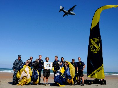 US Navy 100320-N-5366K-103 The Leap Frogs present a signed lithograph to Rob Wallace of the Naval Special Warfare Foundation after the team performed during the kick-off event for the 2010 Daytona Frogman Triathlon