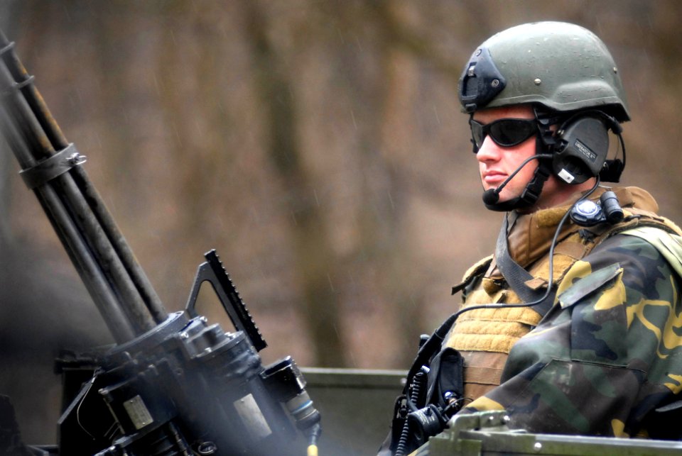 US Navy 100321-N-3136P-209 Engineman 2nd Class Robert Bender, assigned to Riverine Squadron (RIVRON) 1, mans a .50-caliber automatic machine gun during a six-day field exercise at Ft. Knox, Ky