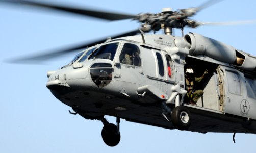 US Navy 100321-N-7508R-371 An MH-60S Sea Hawk helicopter from Helicopter Sea Combat Squadron (HSC) 9 prepares to land aboard the multipurpose amphibious assault ship USS Bataan (LHD 5) photo