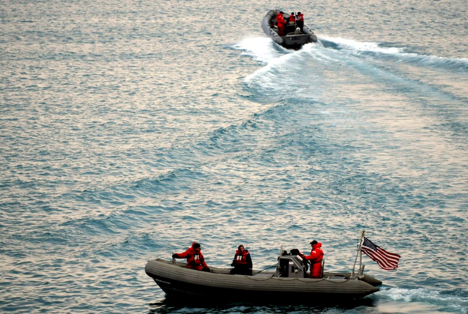 US Navy 100318-N-7280V-325 Sailors assigned to the U.S. 7th Fleet command ship USS Blue Ridge (LCC 19) conduct a nighttime small-boat attack force protection drill in the harbor of Busan, Republic of Korea