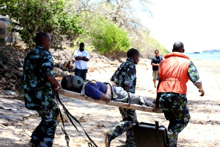 US Navy 100322-N-4205W-078 Members of the Kenya Special Boat Unit tow a casualty to their boat during a simulated mass casualty drill photo