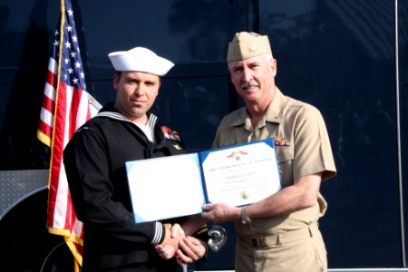 US Navy 100318-N-6936D-024 Rear Adm. Tim Alexander, commander of Navy Region Southeast, presents the Bronze Star medal to Explosive Ordnance Disposal Technician 1st Class Jason Miller
