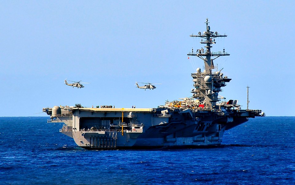 US Navy 100323-N-4774B-038 SH-60F Sea Hawk helicopters assigned to the Red Lions of Helicopter Anti-submarine Squadron (HS) 15 fly over the Nimitz-class aircraft carrier USS Carl Vinson (CVN 70) during an air power demonstratio