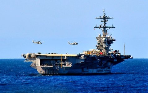 US Navy 100323-N-4774B-038 SH-60F Sea Hawk helicopters assigned to the Red Lions of Helicopter Anti-submarine Squadron (HS) 15 fly over the Nimitz-class aircraft carrier USS Carl Vinson (CVN 70) during an air power demonstratio