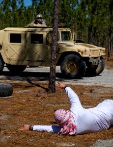 US Navy 100323-N-6932B-444 Sailors respond to a report of an improvised explosive attack in an exercise during the U.S. Navy Individual Augmentee Combat Training course at Fort Jackson, S.C photo