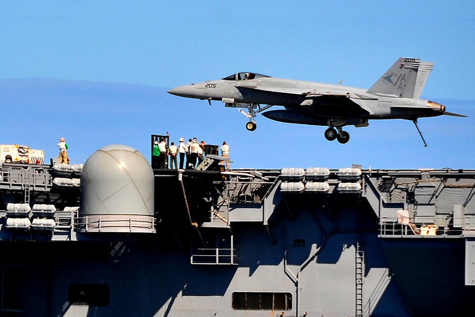 US Navy 100323-N-4774B-384 An FA-18E Super Hornet assigned to the Sunliners of Strike Fighter Squadron (VFA) 81 lands aboard the Nimitz-class aircraft carrier USS Carl Vinson (CVN 70) during a flight demonstration