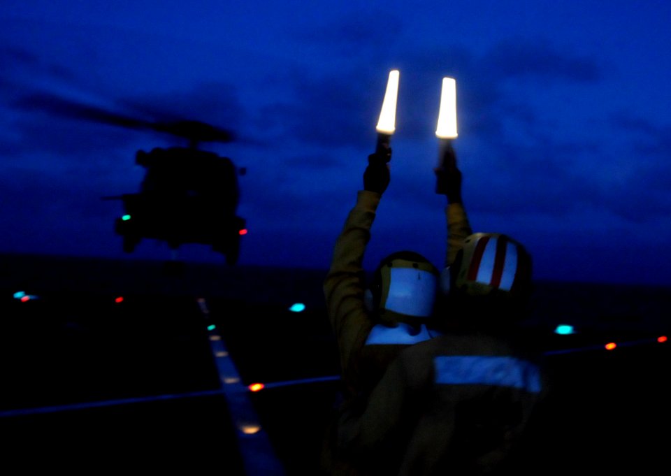 US Navy 100323-N-7478G-280 Sailors launch an SH-60F Sea Hawk helicopter from the U.S. 7th Fleet command ship USS Blue Ridge (LCC 19)