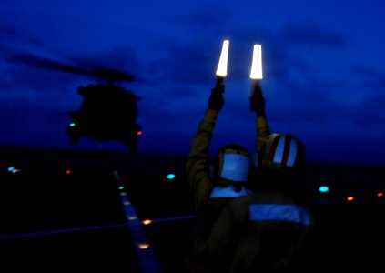 US Navy 100323-N-7478G-280 Sailors launch an SH-60F Sea Hawk helicopter from the U.S. 7th Fleet command ship USS Blue Ridge (LCC 19)