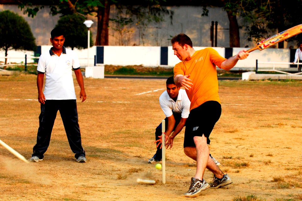 US Navy 100323-N-8335D-590 Mineman 3rd Class John Parker, assigned to the mine countermeasures ship USS Patriot (MCM 7), is taught how to play cricket by Indian navy physical training instructors