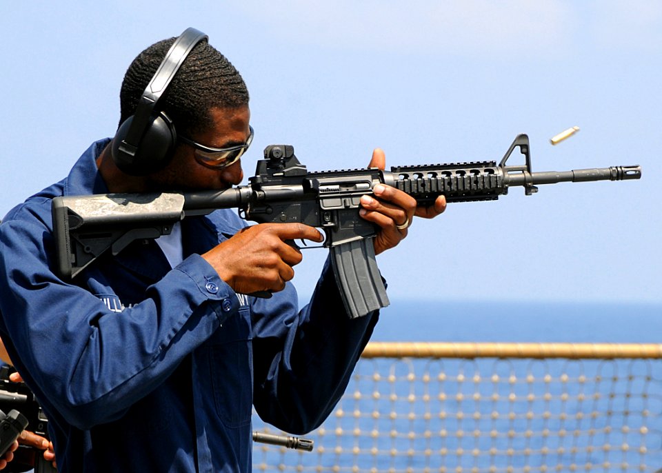 US Navy 100321-N-1082Z-184 Hospital Corpsman Seaman Richard L. Williams shoots an M16 service rifle during a weapons qualification