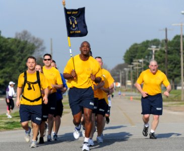 US Navy 100324-N-5862D-003 Chief Petty Officer Greg Fall, right, leads fellow chief petty officers in cadence