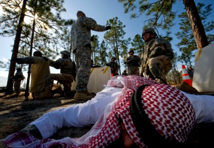 US Navy 100322-N-6932B-038 Staff Sgt. Michael Garza, an Army drill instructor, guides Sailors through entry control point training during the U.S. Navy Individual Augmentee Combat Training course at Fort Jackson, S.C