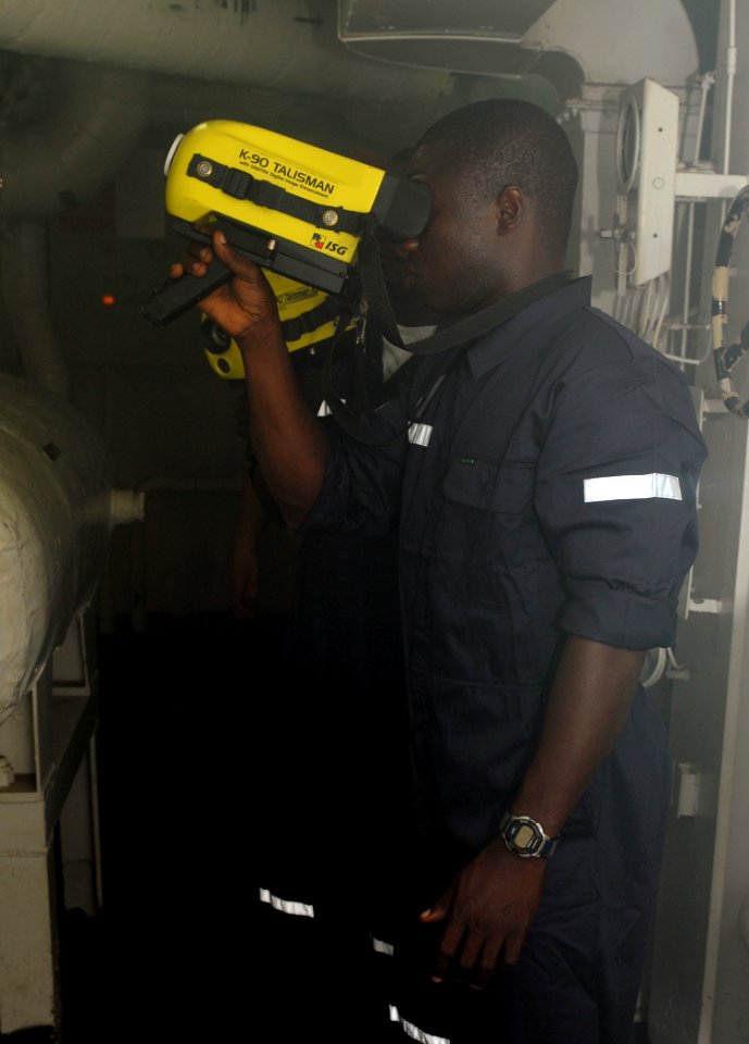 US Navy 100322-N-6676S-030 Benin navy Petty Officer Adoukonou Jacques, right, and Chief Hekponwe Severin use a Navy fire-fighting thermal imagery device