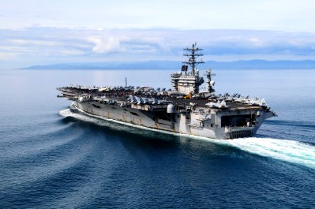 US Navy 100323-N-3327M-045 Sailors and more than 1,000 friends and family members aboard the aircraft carrier USS Nimitz (CVN 68) depart Bremerton, Wash. for a Tiger Cruise to the ship's homeport in San Diego, Calif