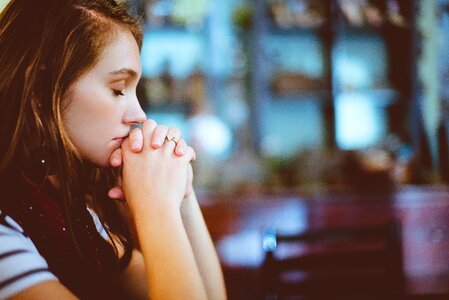 Girl praying church photo