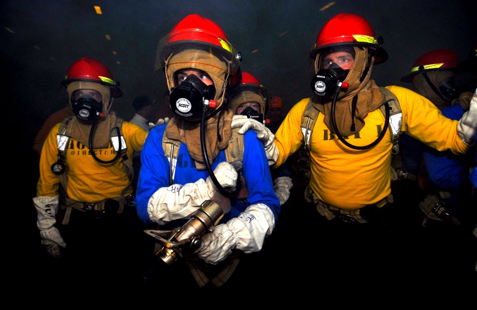 US Navy 100325-N-6003P-647 Sailors prepare to fight a simulated fire during a general quarters drill