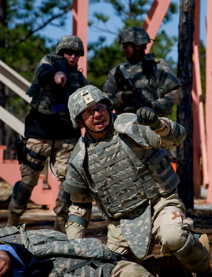 US Navy 100323-N-6932B-457 Hospital Corpsman 1st Class Anthony Wivell provides emergency medical assistance in a simulated improvised explosive attack