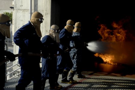 US Navy 100325-N-6552M-083 Sailors and Coast Guardsman put out a controlled fire at the Center for Naval Engineering Site, San Diego.
