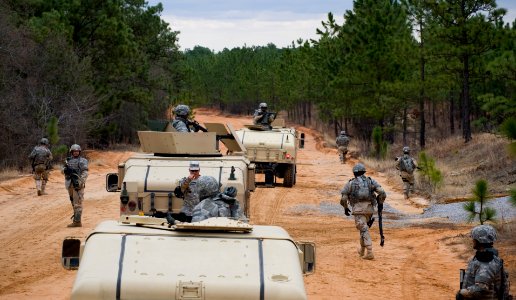 US Navy 100322-N-6932B-287 Staff Sgt. David Garland, an Army drill instructor, guides Sailors through convoy training during the U.S. Navy Individual Augmentee Combat Training course at Fort Jackson, S.C