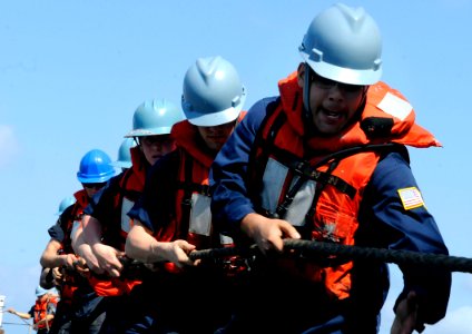 US Navy 100324-N-7478G-374 Sailors aboard the U.S. 7th Fleet command ship USS Blue Ridge (LCC 19) heave a line during a replenishment at sea