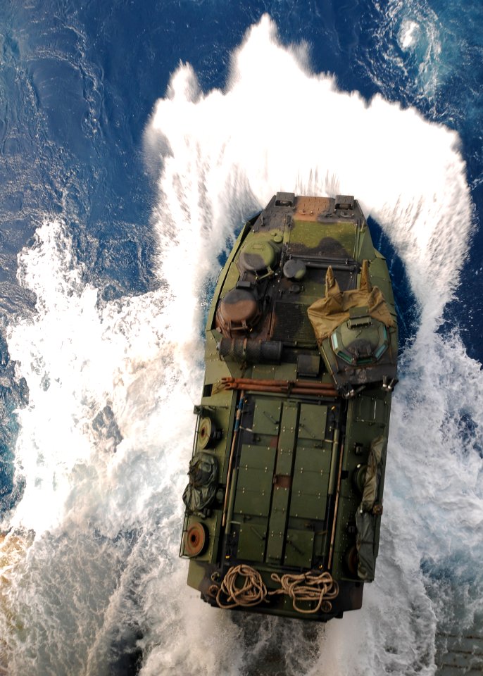 US Navy 100323-N-9950J-099 An amphibious assault vehicle assigned to the 31st Marine Expeditionary Unit (31st MEU) debarks the well deck of the forward-deployed amphibious assault ship USS Essex (LHD 2)