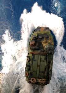 US Navy 100323-N-9950J-099 An amphibious assault vehicle assigned to the 31st Marine Expeditionary Unit (31st MEU) debarks the well deck of the forward-deployed amphibious assault ship USS Essex (LHD 2)