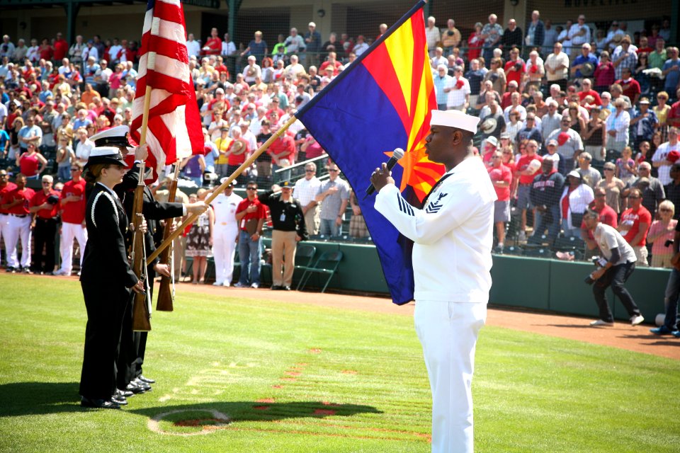 US Navy 100324-N-3271W-097 Navy Counselor 1st Class Steven Powell sings the national anthem before a pre-season Major League baseball game between the Los Angeles Angels and the Kansas City Royals at Tempe Diablo Stadium