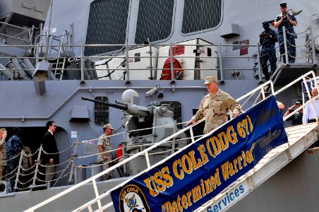 US Navy 100326-N-8273J-314 Chief of Naval Operations (CNO) Adm. Gary Roughead departs the guided-missile destroyer USS COLE (DDG 67) after visiting with Sailors aboard the ship
